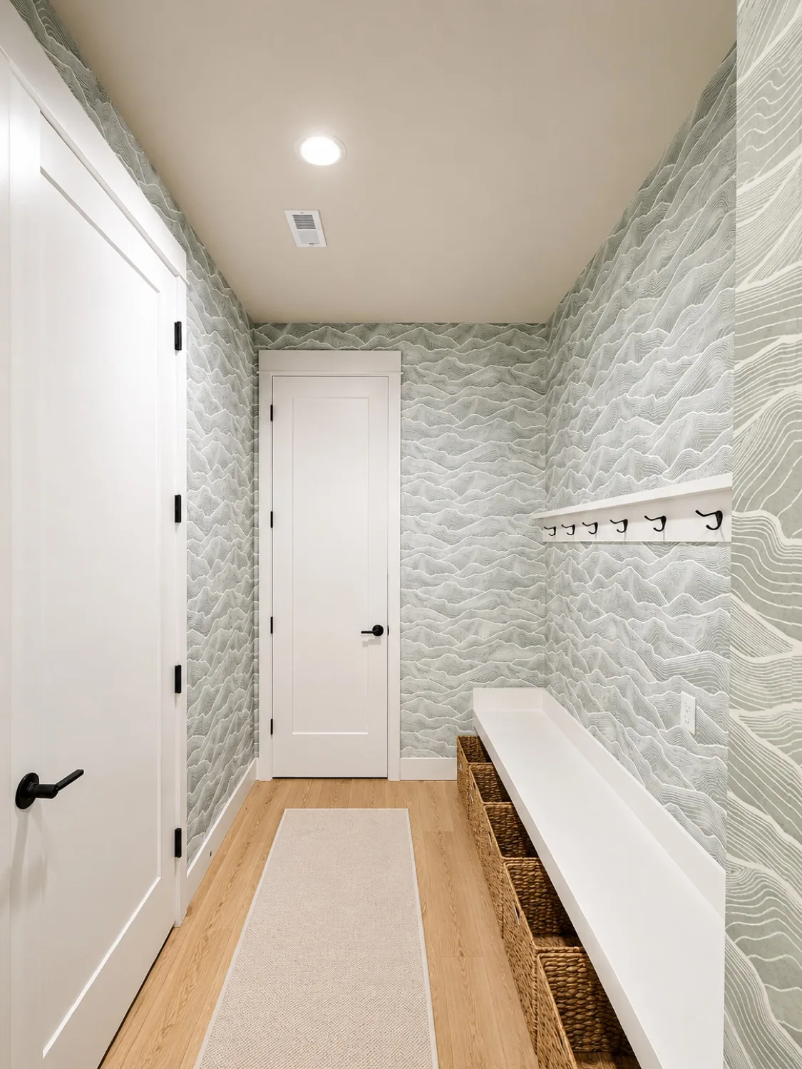Measuring a wall before wallpaper installation